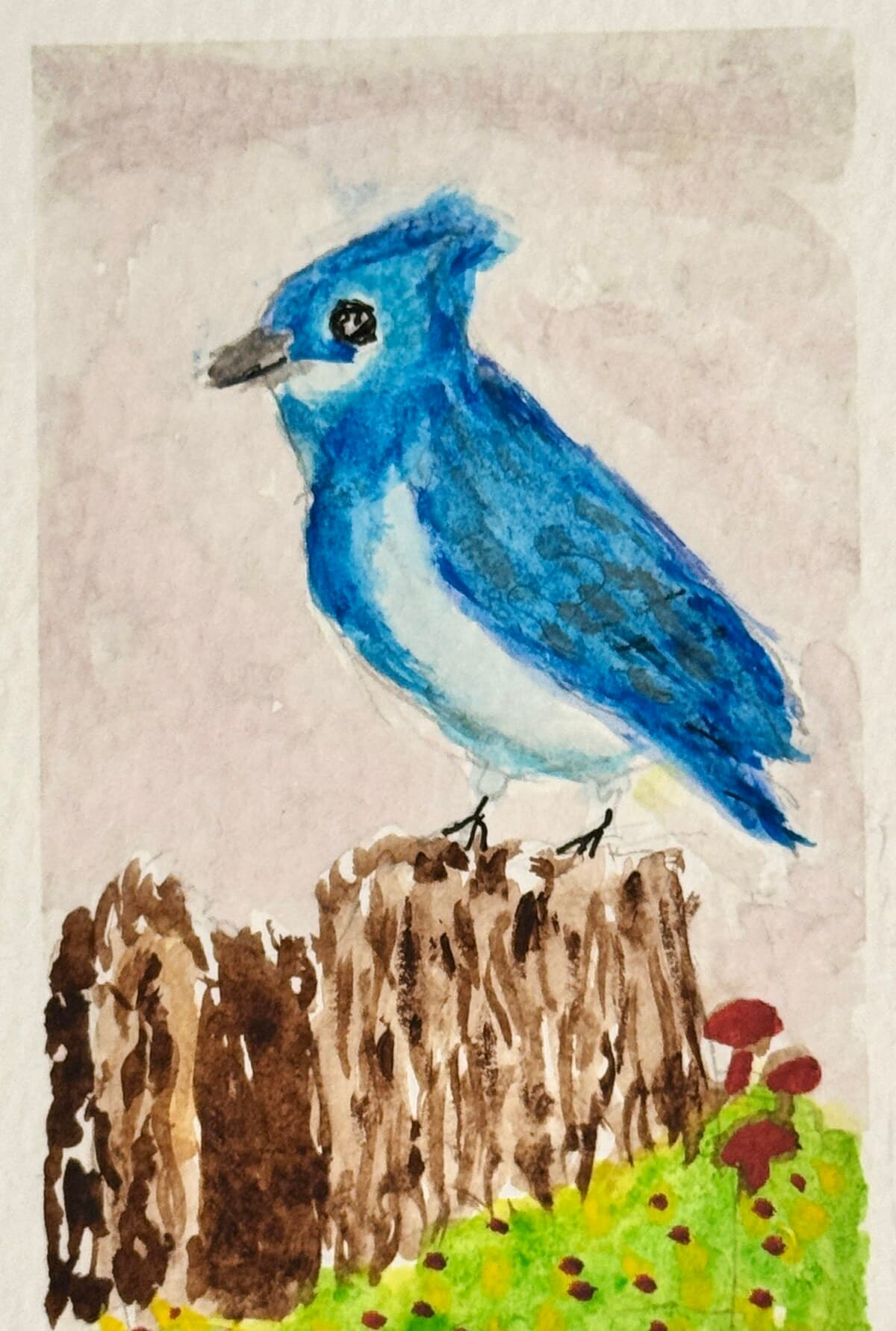 Watercolor of a bright blue jay perched on a mossy tree stump with tiny red mushrooms